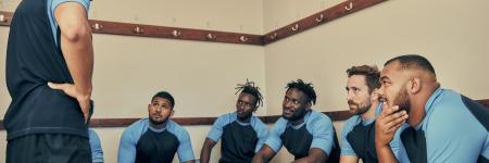 five sports teammates having a conversation