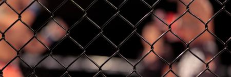 two mixed martial arts athletes are preparing for a match in the ring