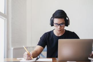 student studying with a laptop