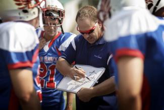 coach working with athletes