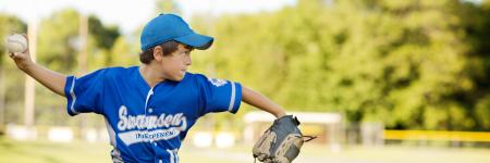 Young Baseball player throwing ball